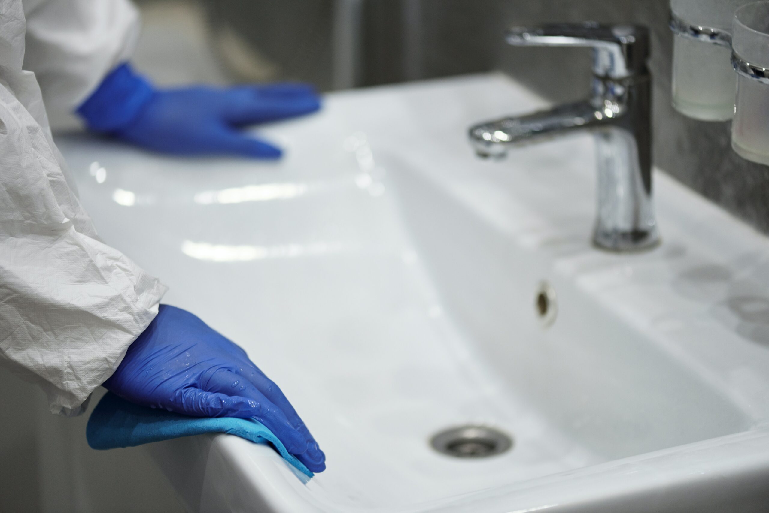 cleaning-the--with-blue-gloves