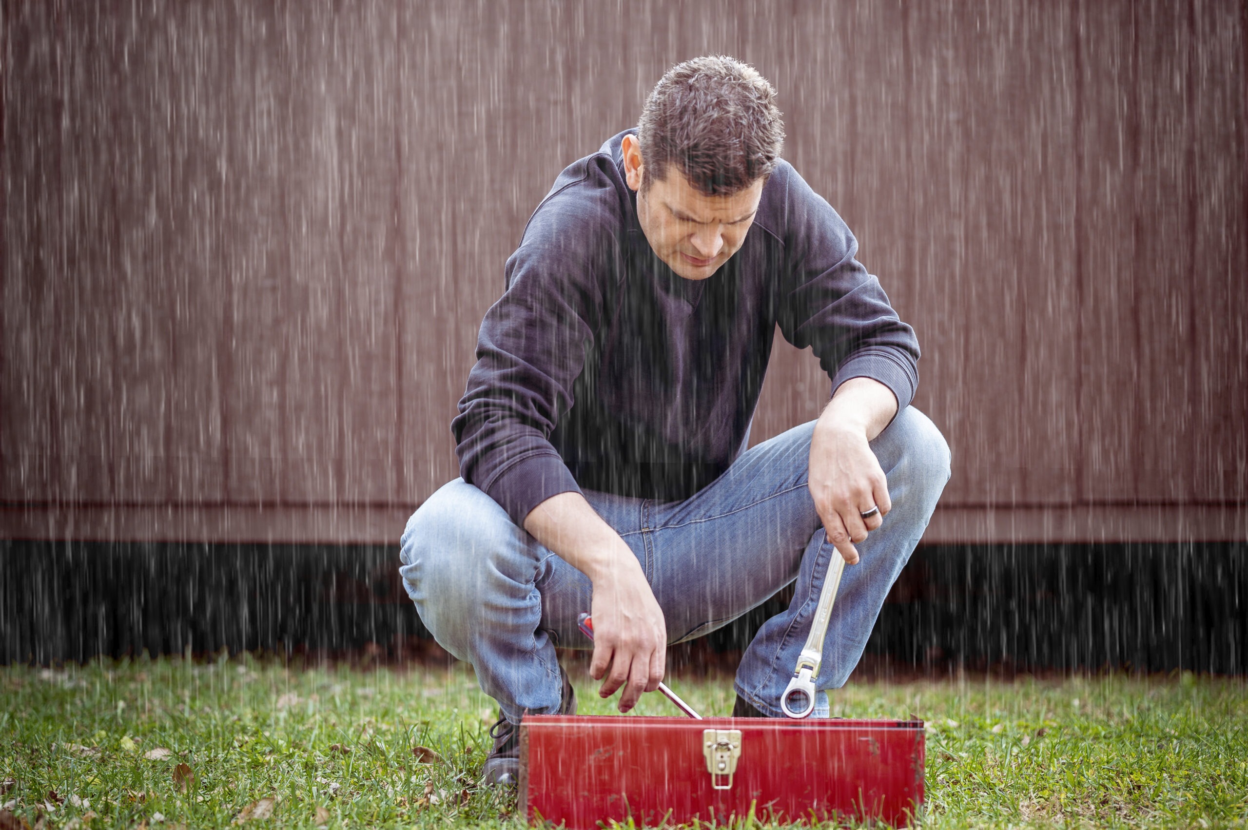 man-with-toolbox-rain